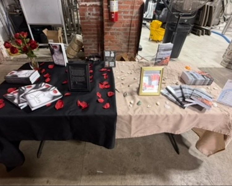Chloe Ruffennach's book table display of the sci-fi novel Siren and the domestic suspense novel Wisteria Drive.
